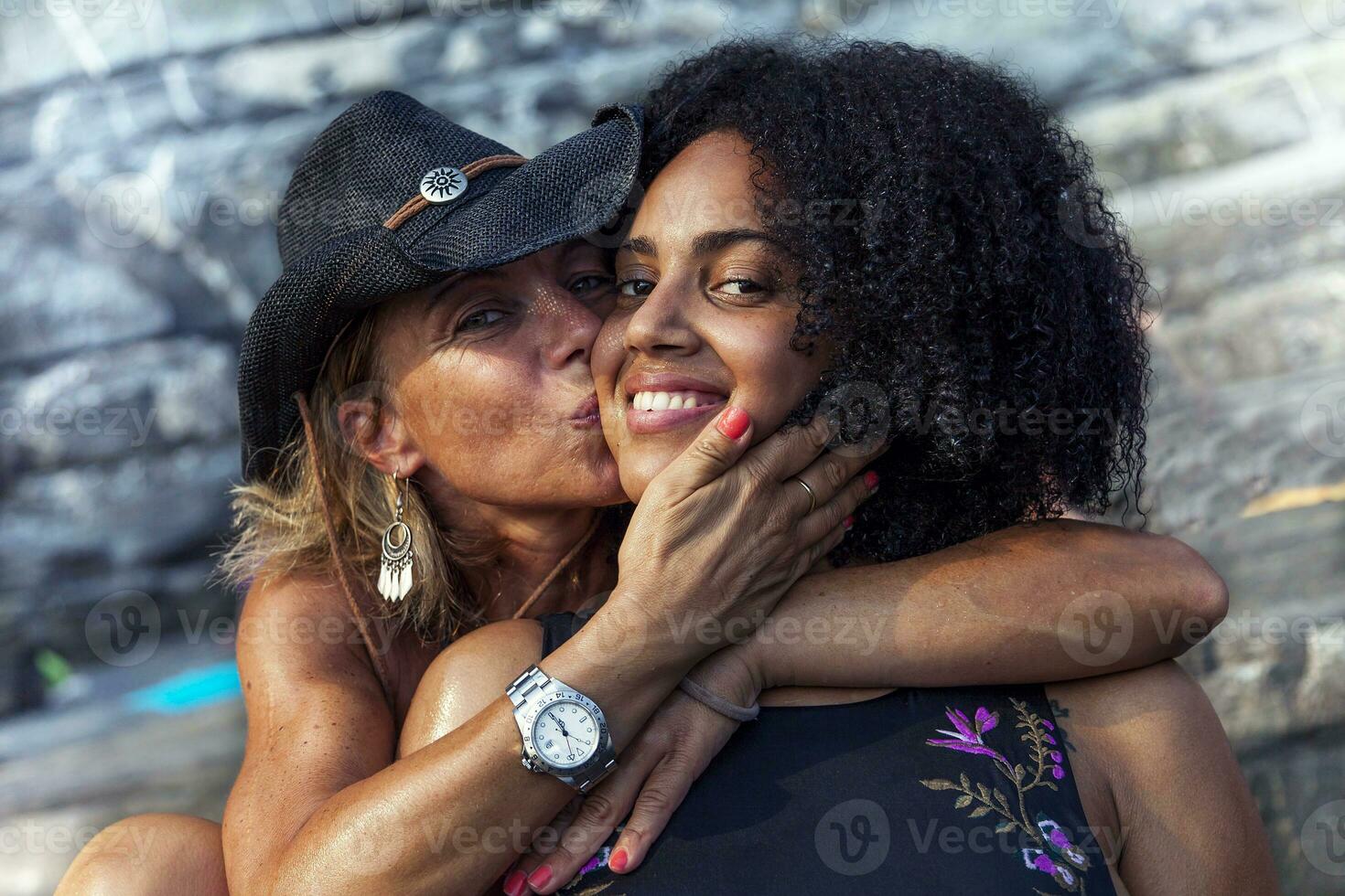 couple of beautiful women hugging photo