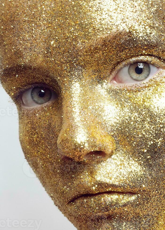 Magic Girl Portrait in Gold. Golden Makeup photo
