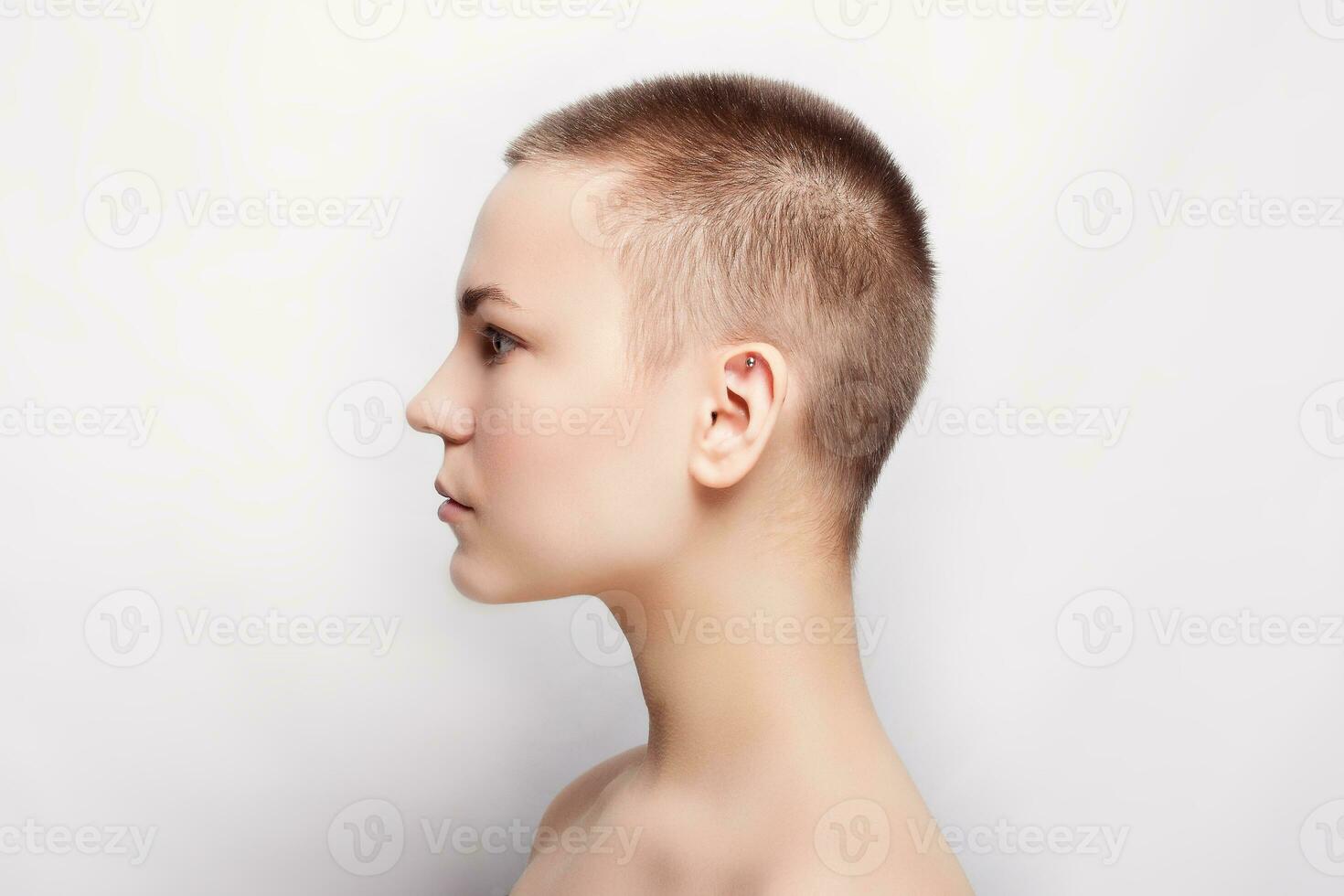 Beauty portrait of young girl profile with short hair photo