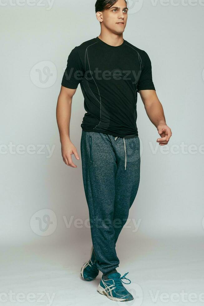 Studio shot of a handsome young fitness man photo