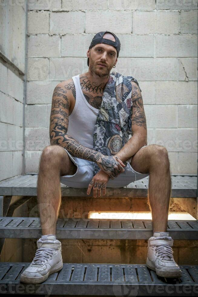 young caucasian tattooed singer rap posing photo