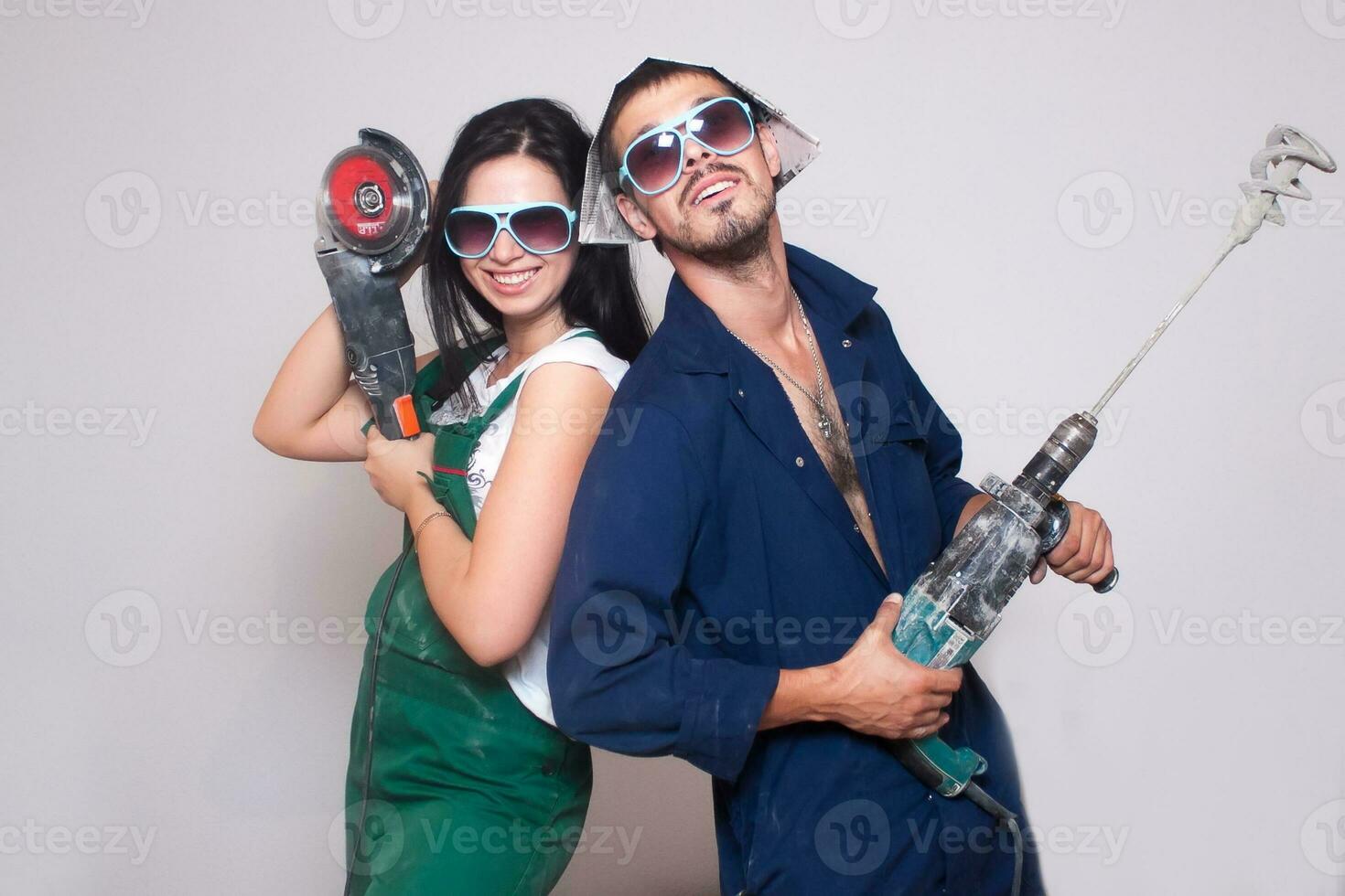 Male and female construction workers photo