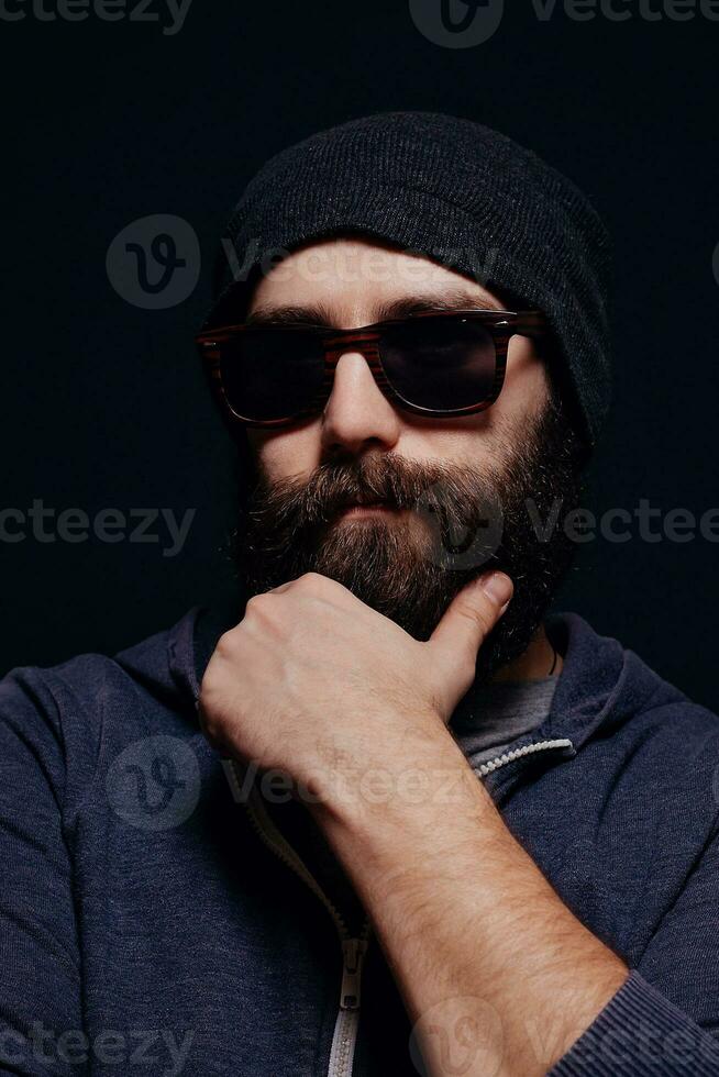Handsome male big beard in glasses and hat photo