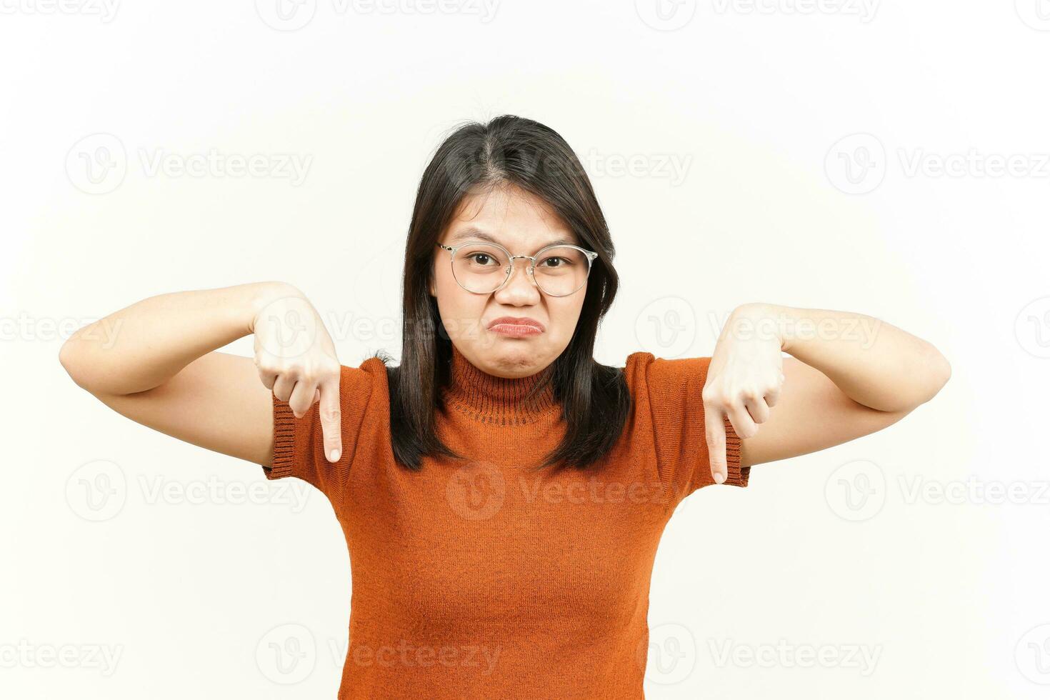 Showing Product and Pointing Down Of Beautiful Asian Woman Isolated On White Background photo