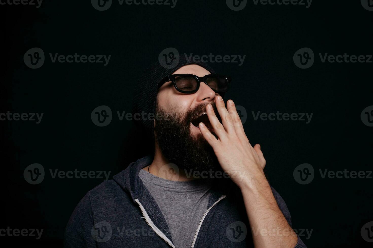 Handsome male big beard in glasses and hat photo