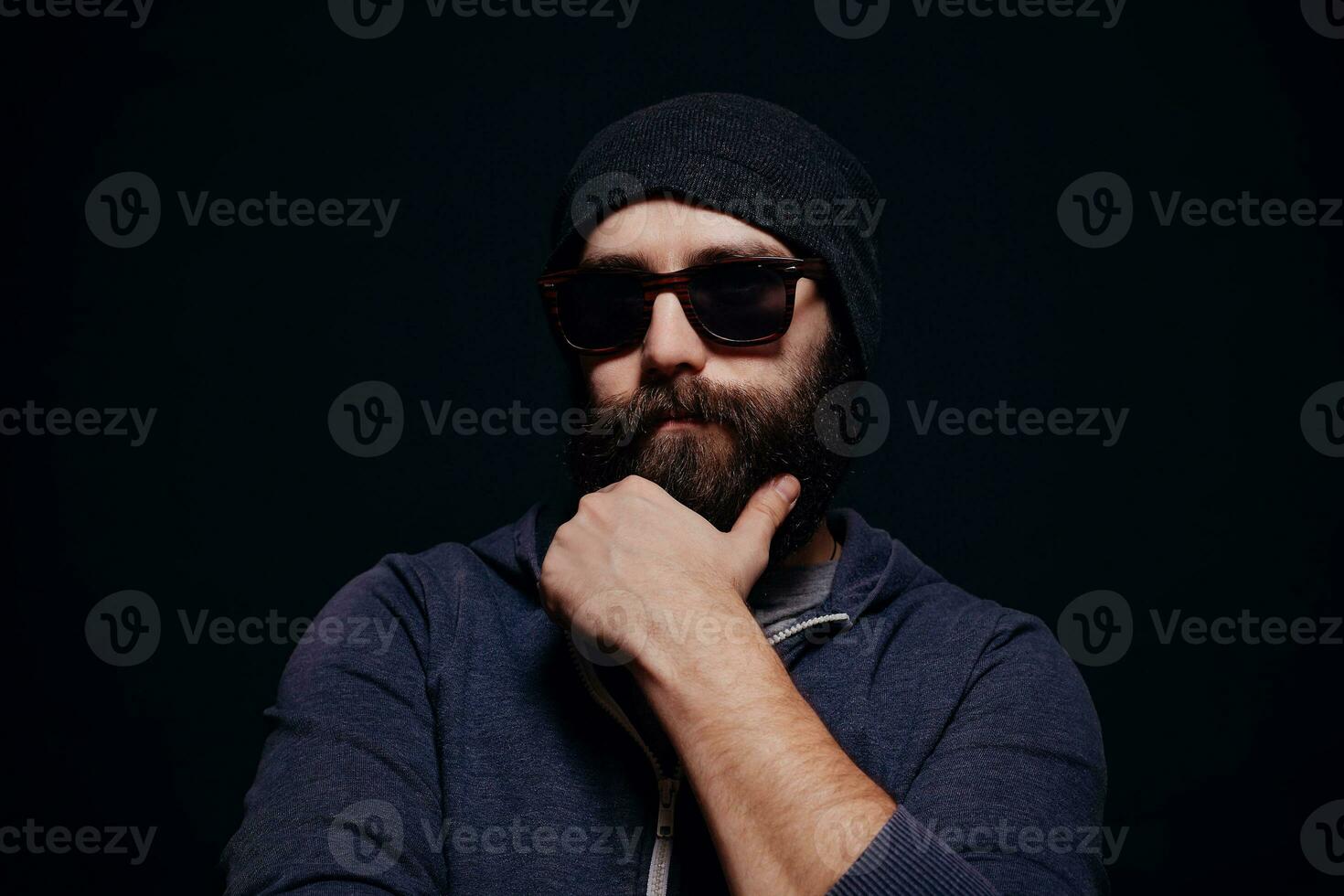 Handsome male big beard in glasses and hat photo