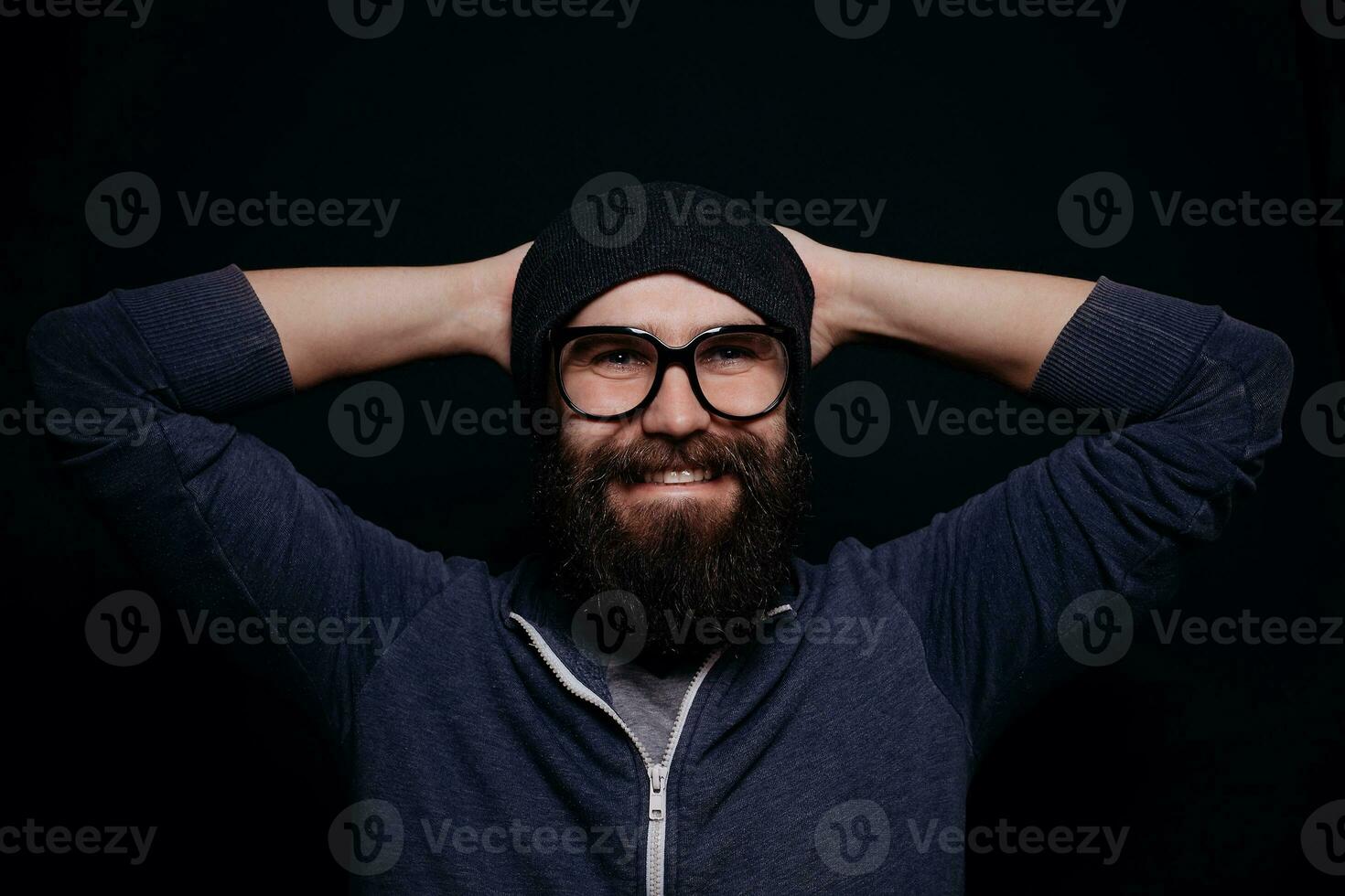 Handsome male big beard in glasses and hat photo