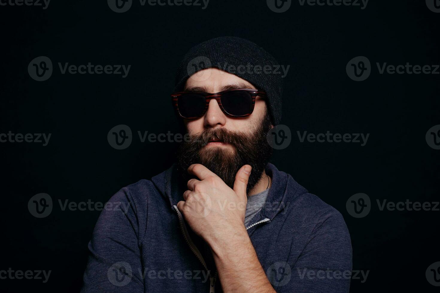 Handsome male big beard in glasses and hat photo