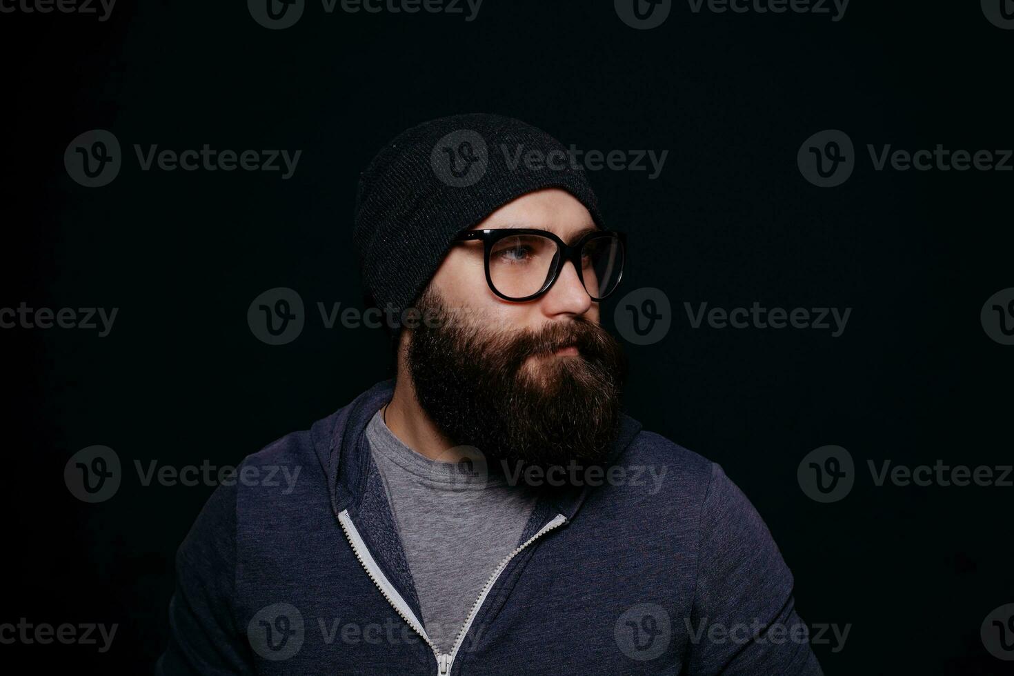 Handsome male big beard in glasses and hat photo