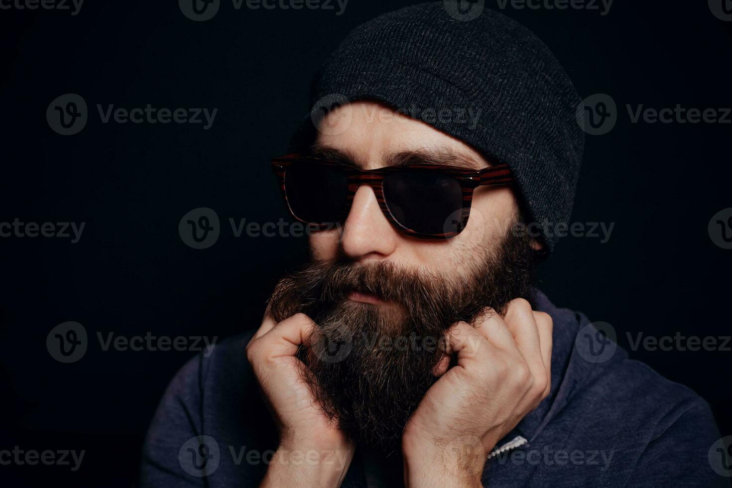 Handsome male big beard in glasses and hat photo