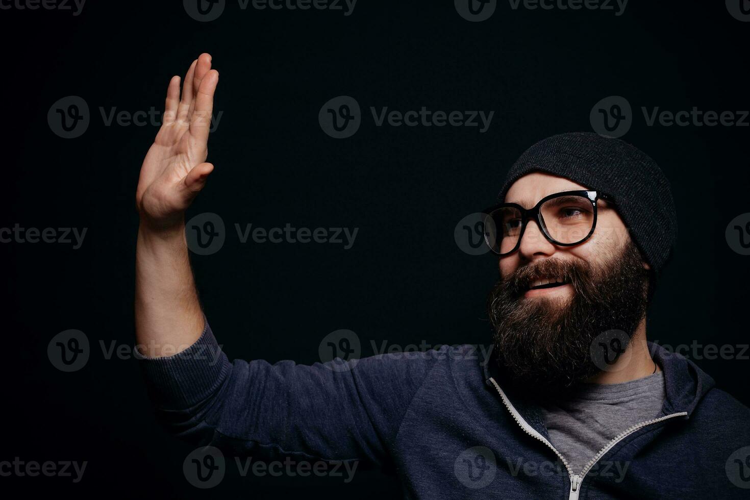 Handsome male big beard in glasses and hat photo