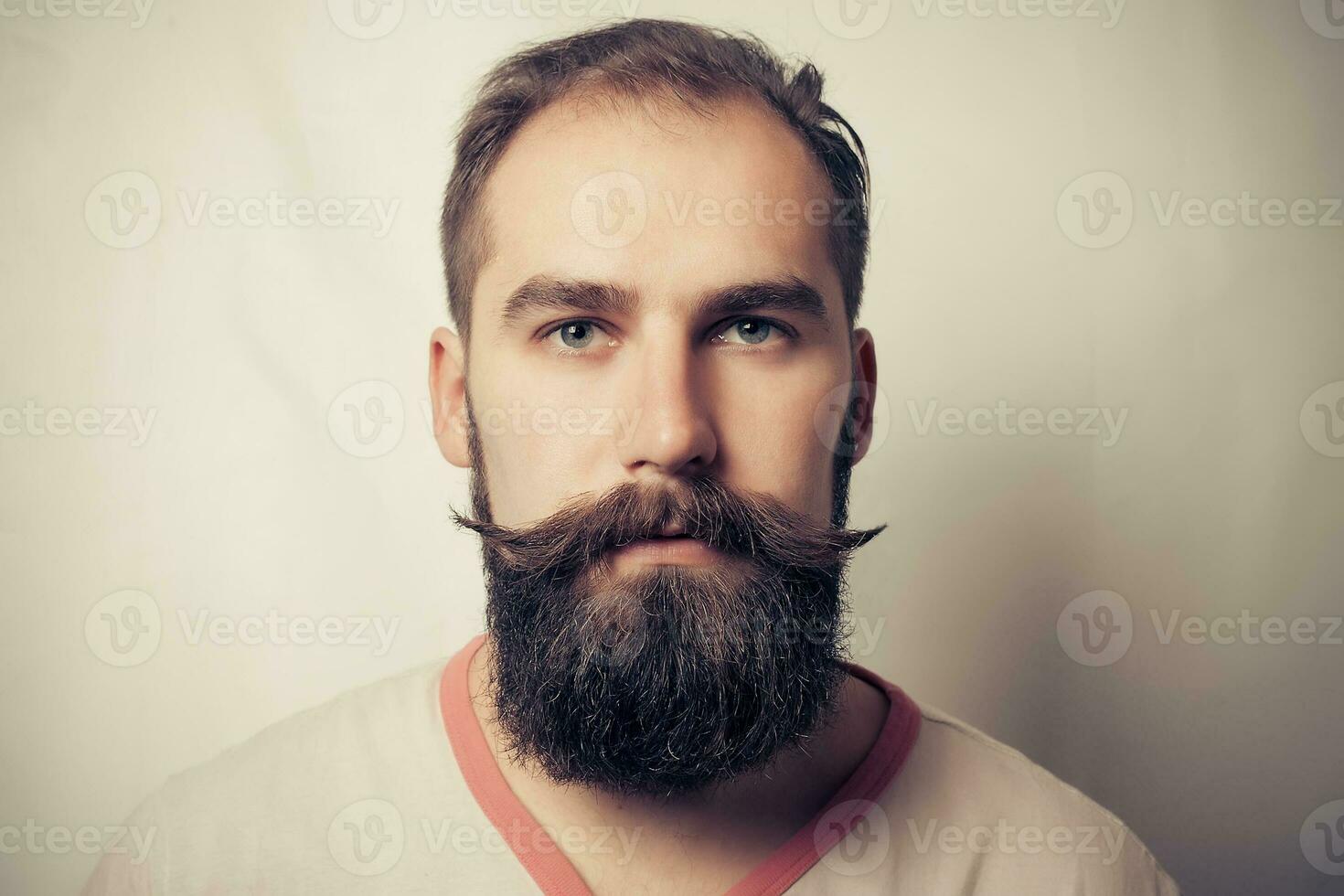 Portrait of tattooed bearded man photo