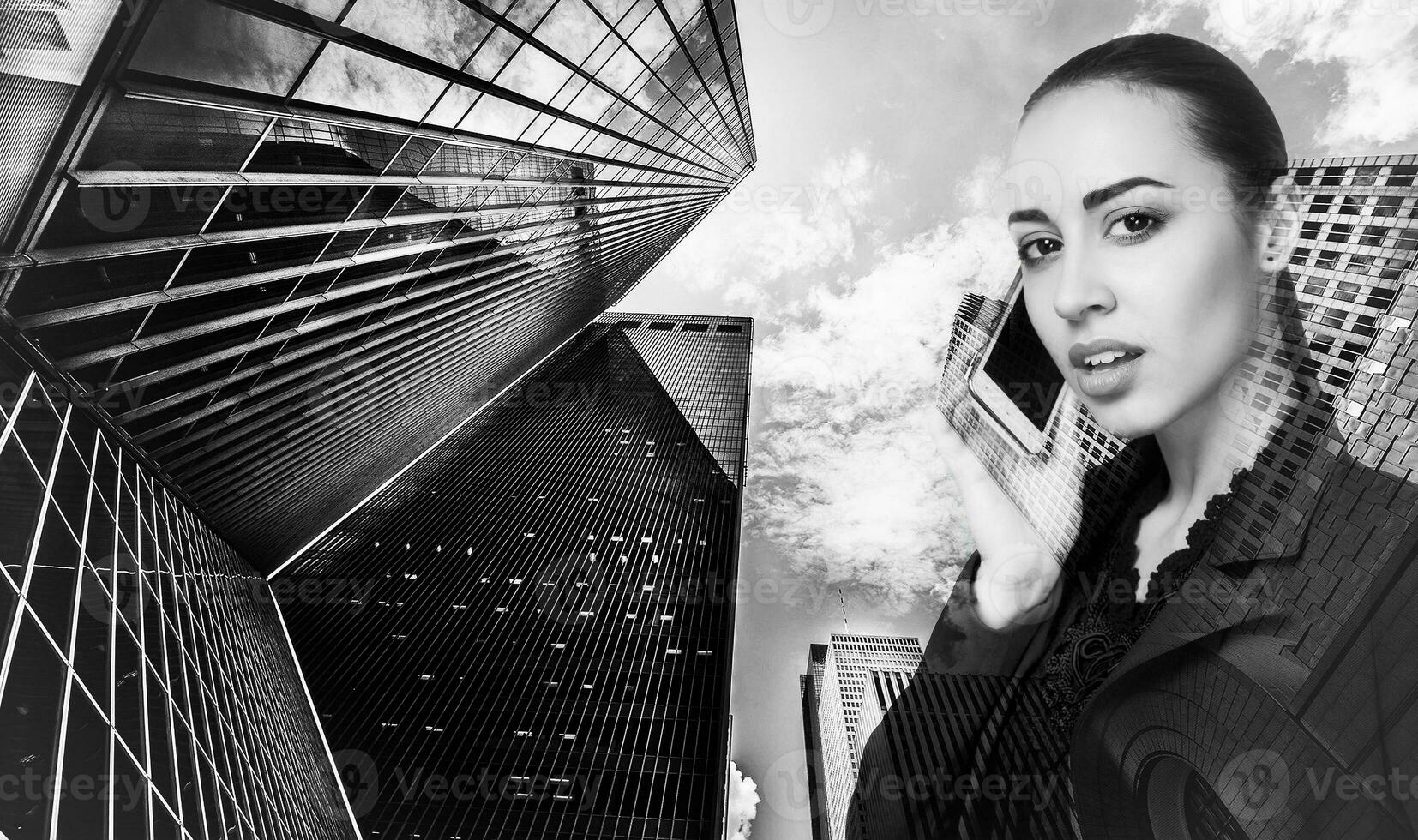 Double exposure of city and beautiful business woman folded her arms monochrome photo