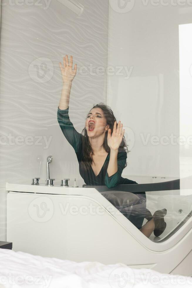 Screaming Angry Woman Sitting on Couch at home photo