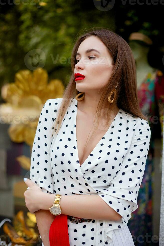 beautiful model look brunette female wearing white polka dots photo