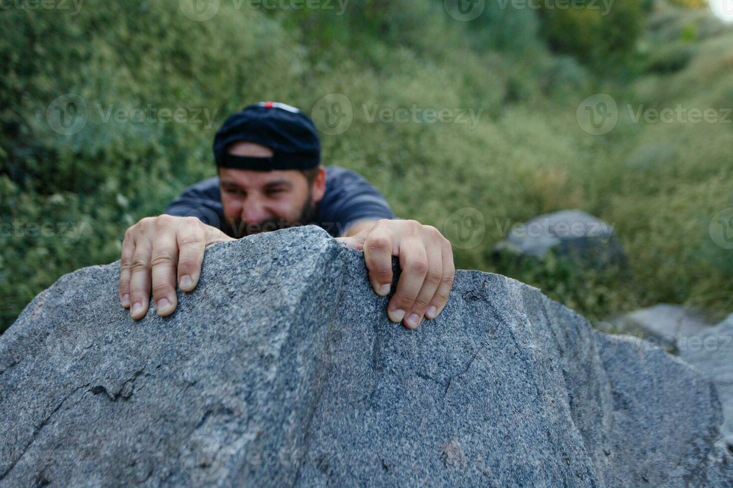 Mountain Climber Man Reaching The Top Doing His Best. Closeup on Hand. photo