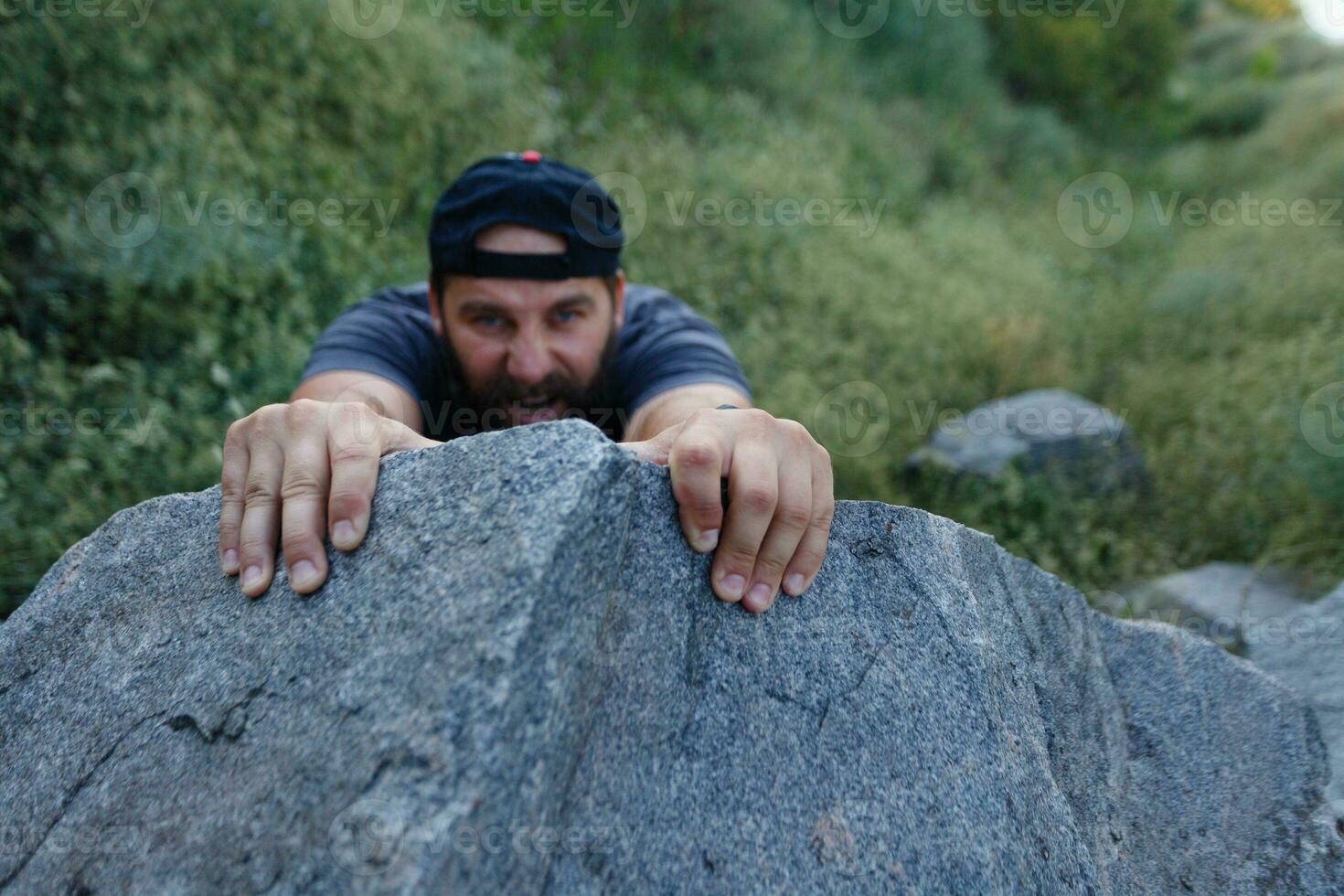 Mountain Climber Man Reaching The Top Doing His Best. Closeup on Hand. photo