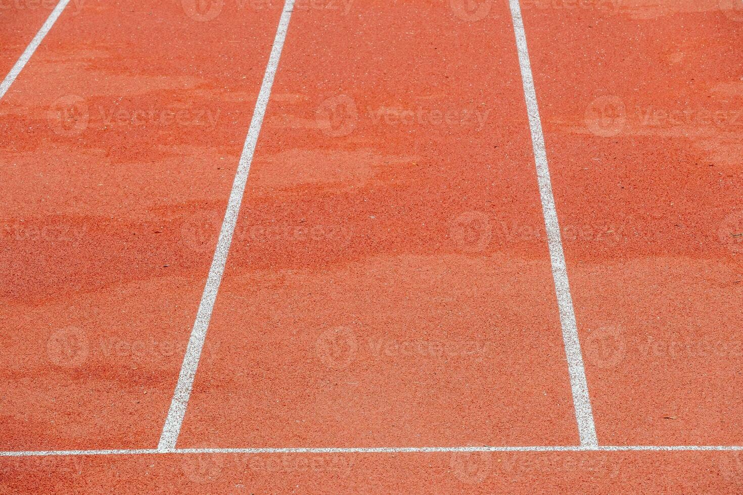 red runway with change markings for a relay race photo
