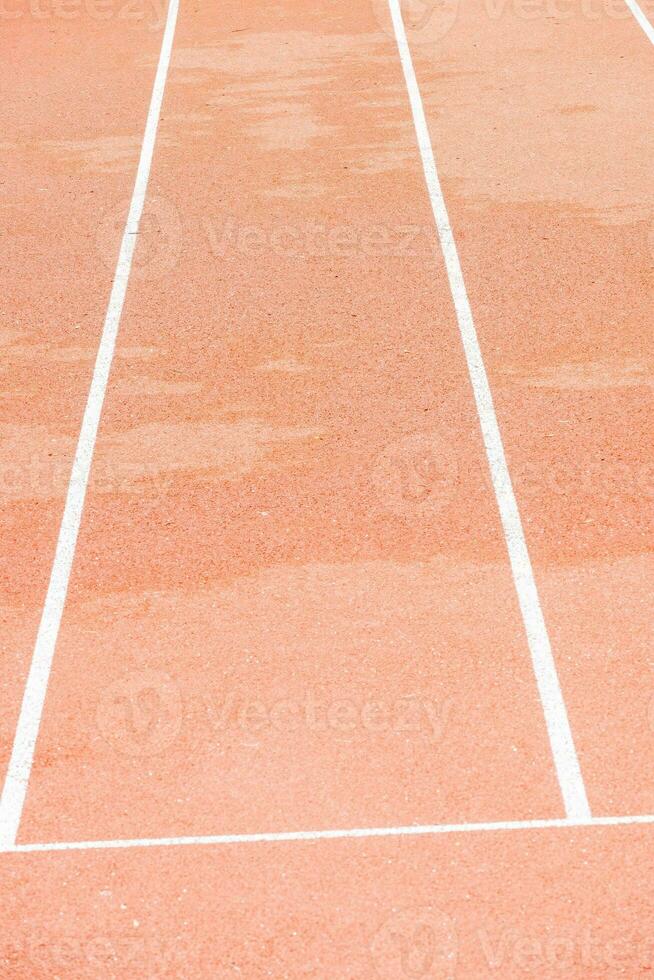 red runway with change markings for a relay race photo
