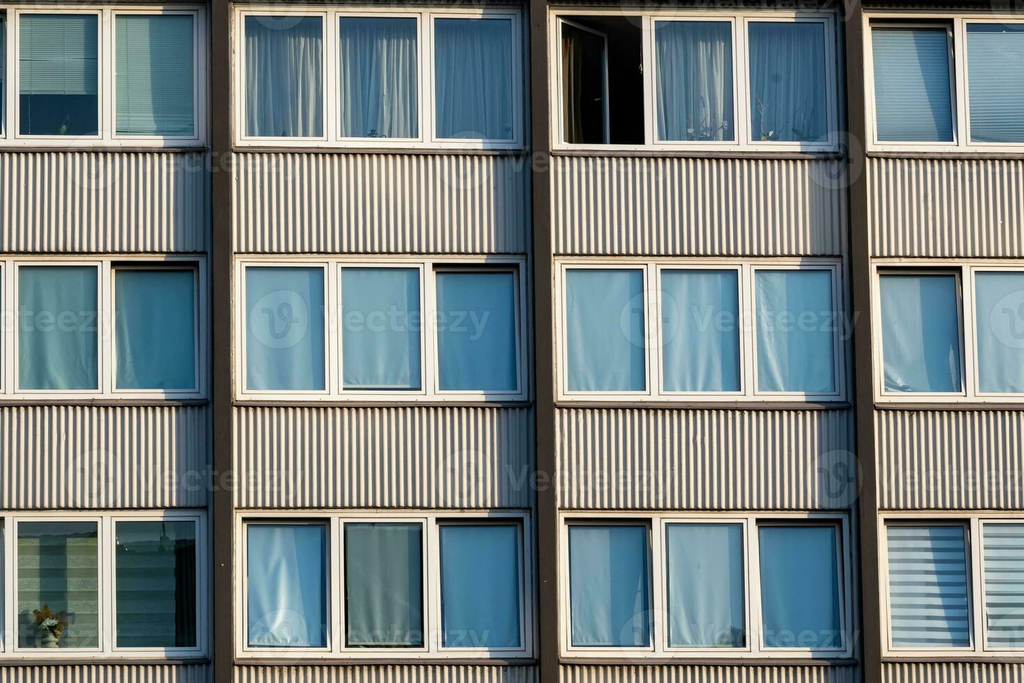Detail of a high-rise building with windows from the 70s photo