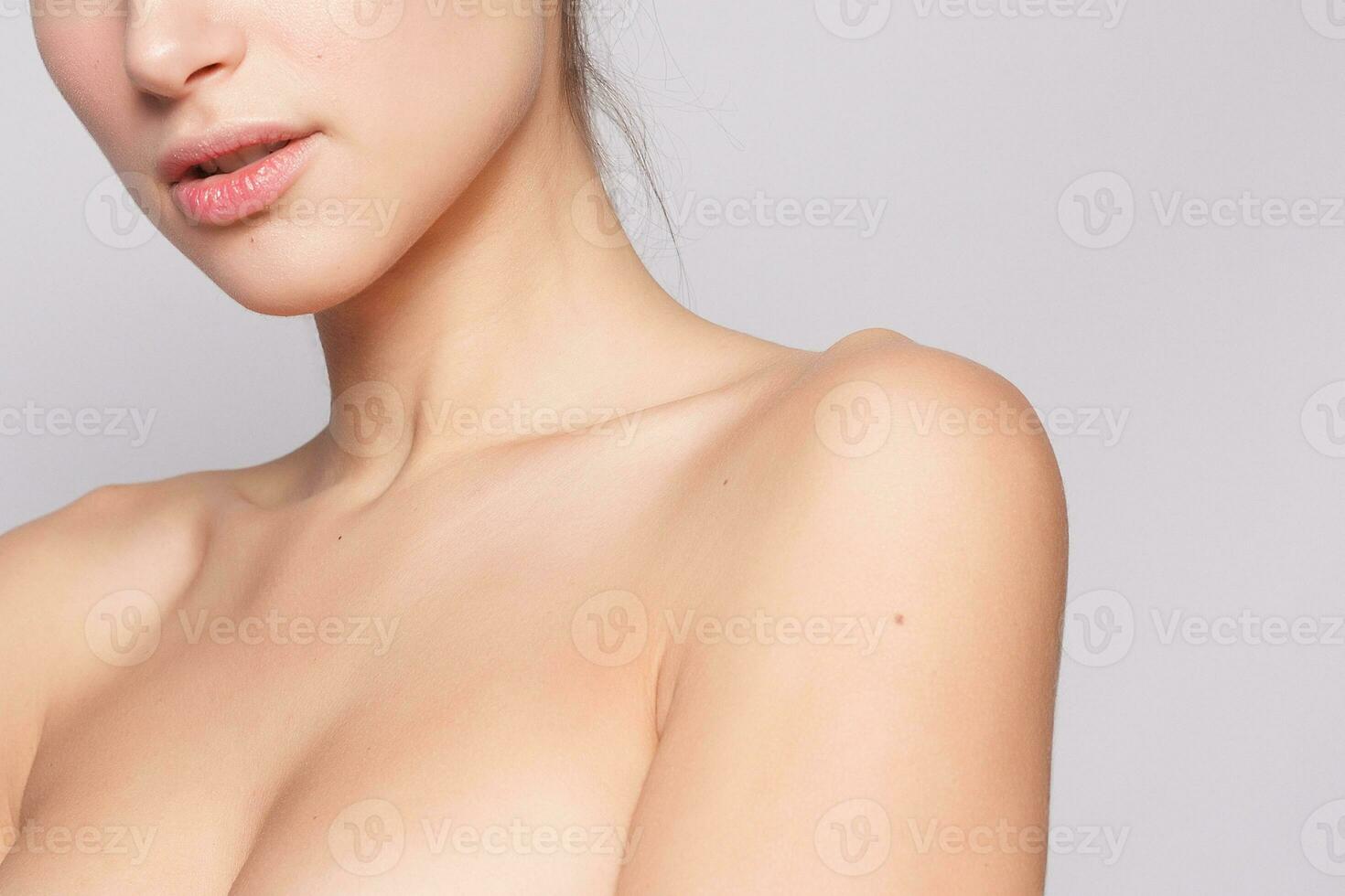 Beautiful Young Woman with Clean Fresh Skin close up photo