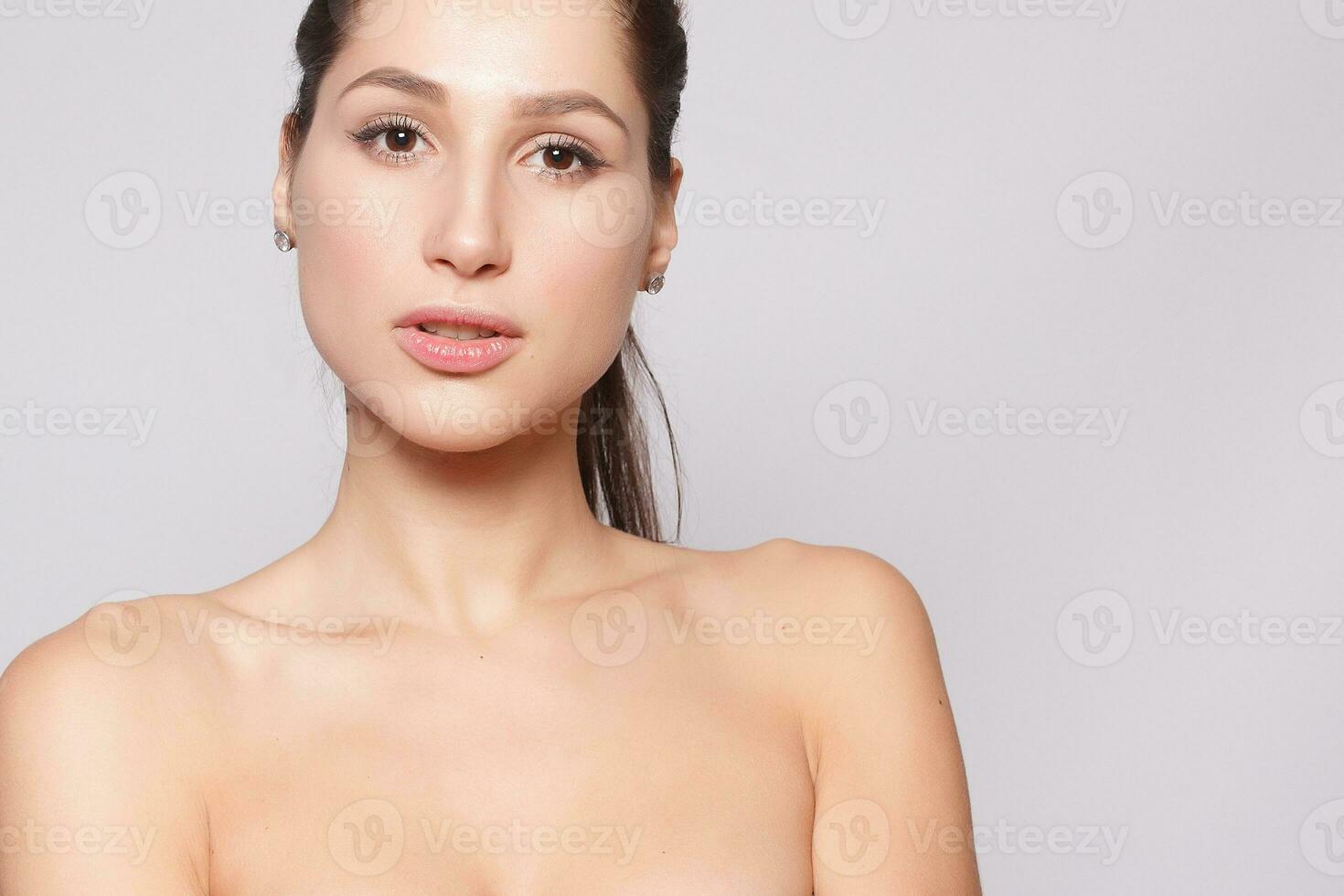Beautiful Young Woman with Clean Fresh Skin close up photo