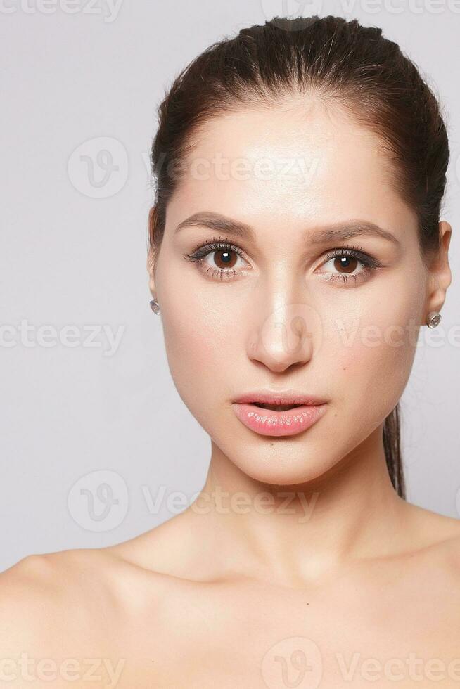 Beautiful Young Woman with Clean Fresh Skin close up photo