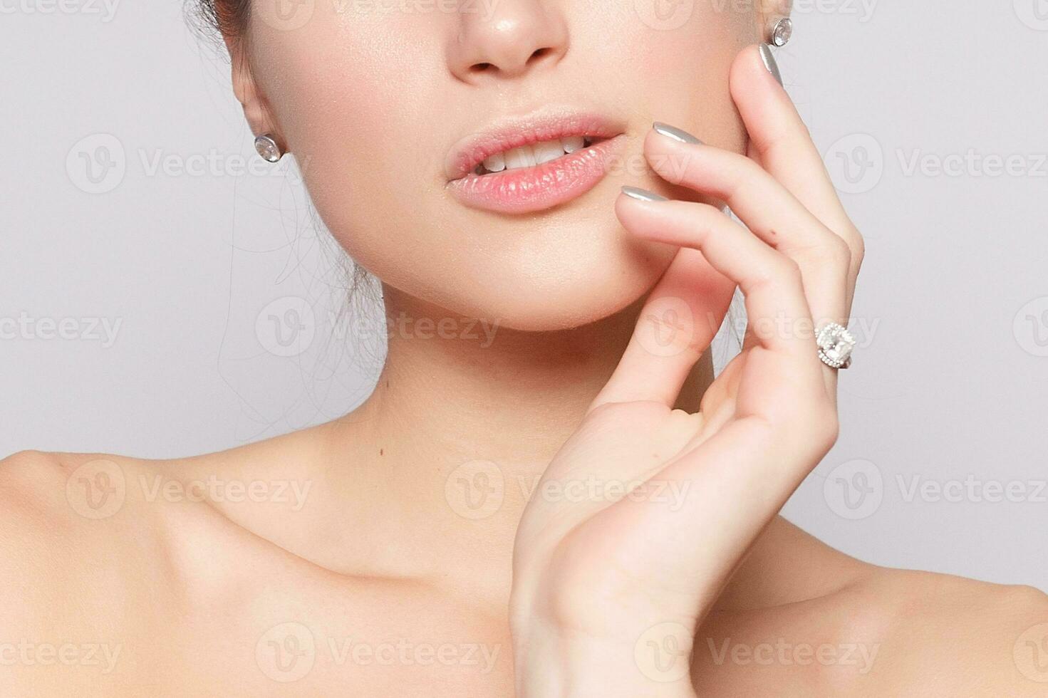 Beautiful Young Woman with Clean Fresh Skin close up photo