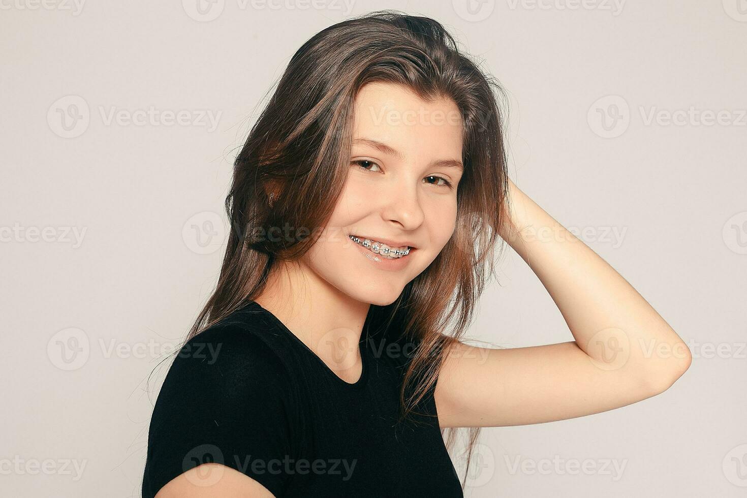 Portrait of teen girl showing dental braces. photo