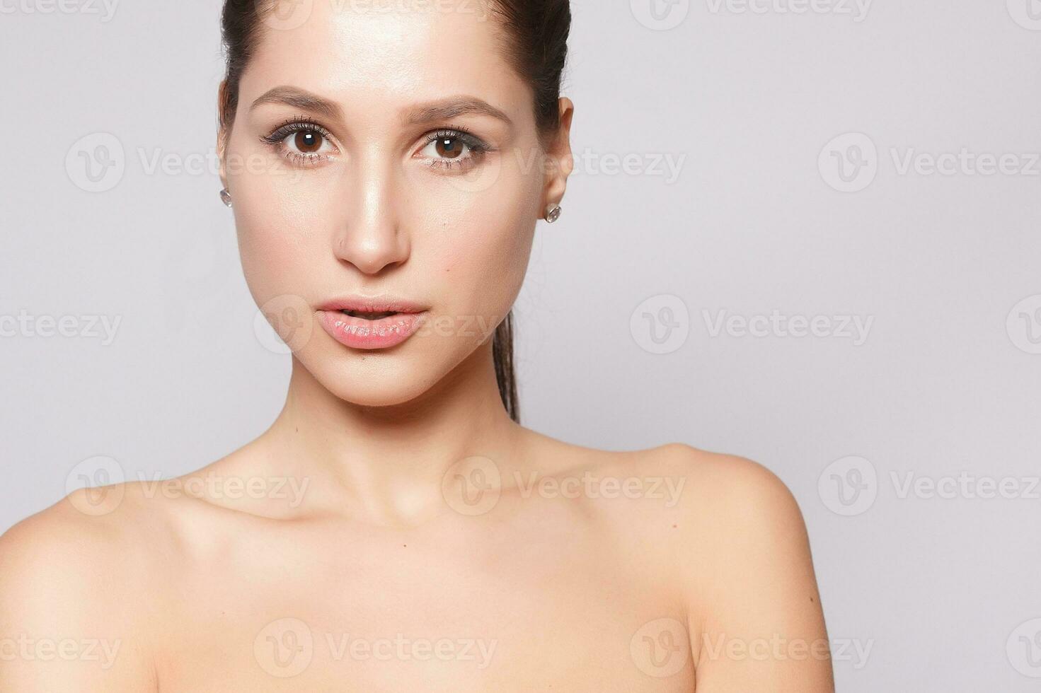 Beautiful Young Woman with Clean Fresh Skin close up photo