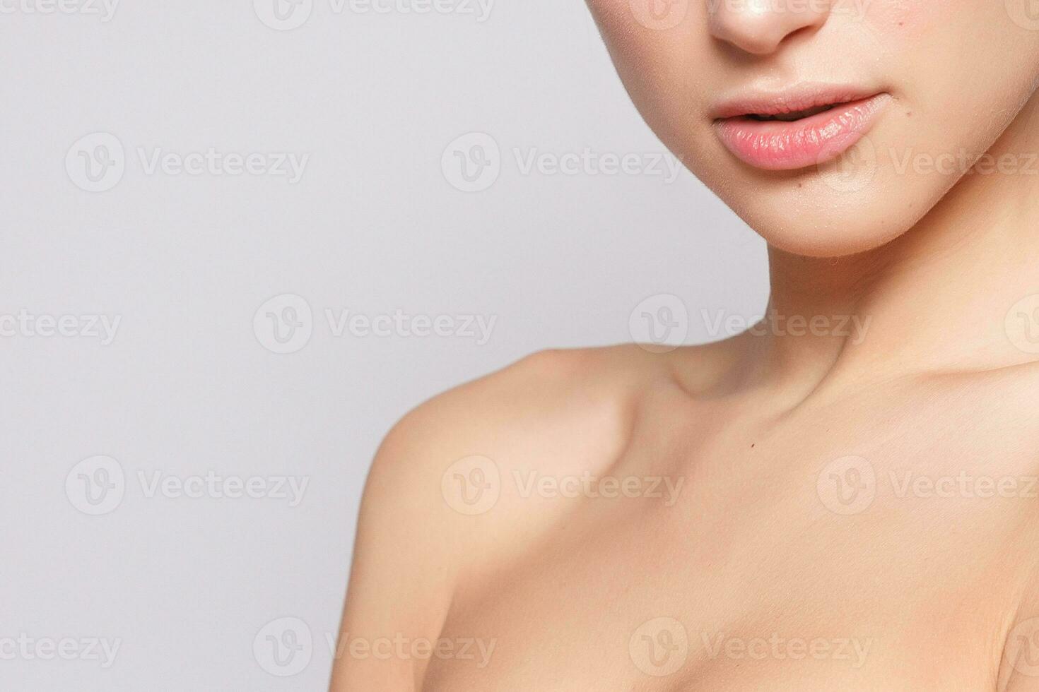 Beautiful Young Woman with Clean Fresh Skin close up photo