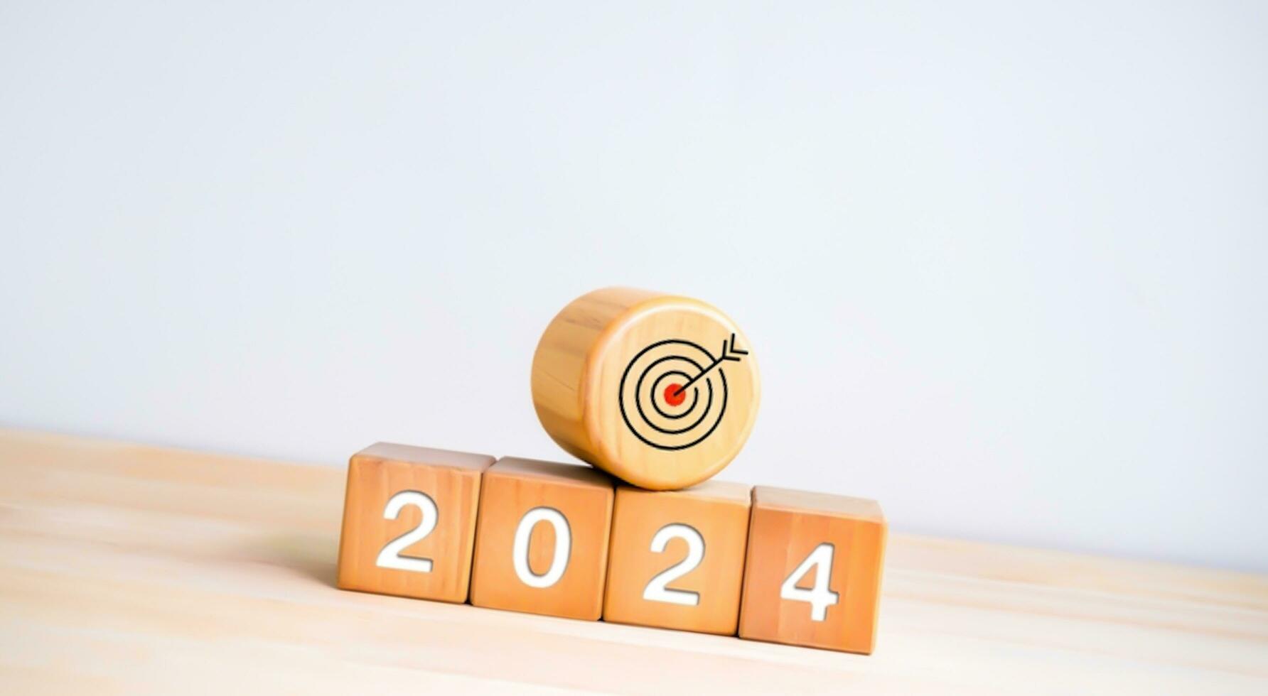 Happy new year 2024, 3d earth orb with digital world map placed on white block stack with 2024 year numbers with searching icon and rising arrow, trend growth graph on blue background. photo