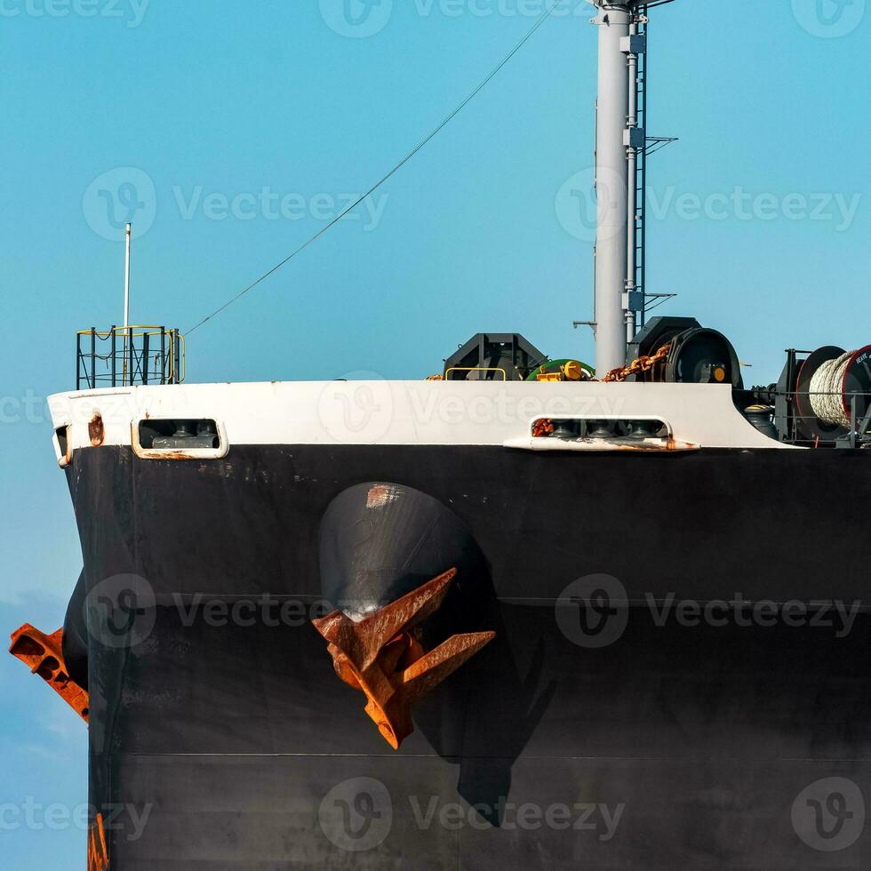 Black bulker ship. Logistics and merchandise transportations photo