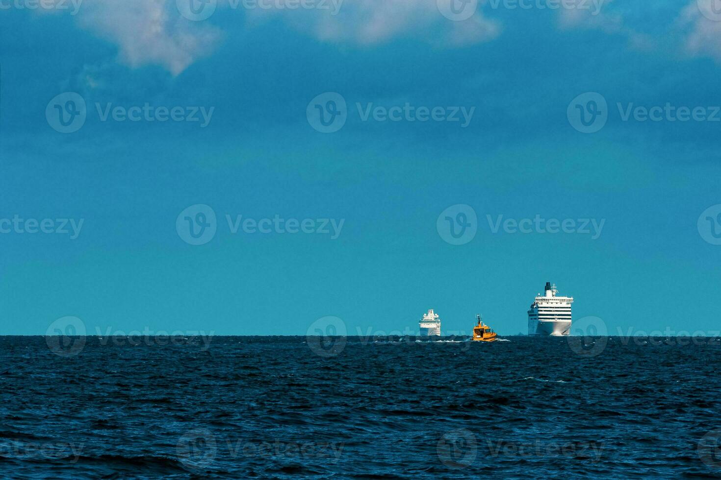 White cruise liner far in sea. Tour travel and spa services photo