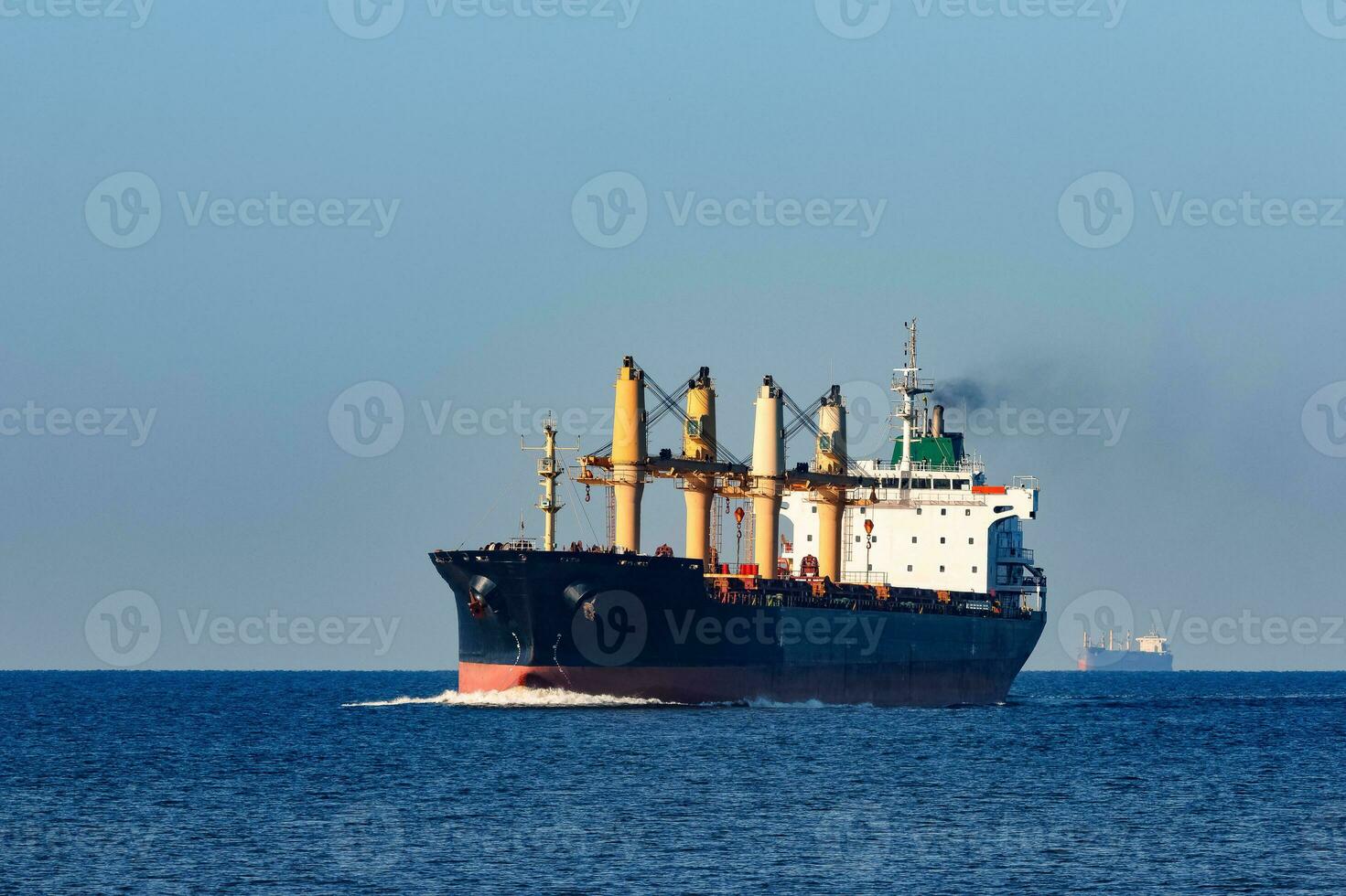 Black cargo ship sailing from the Baltic sea photo