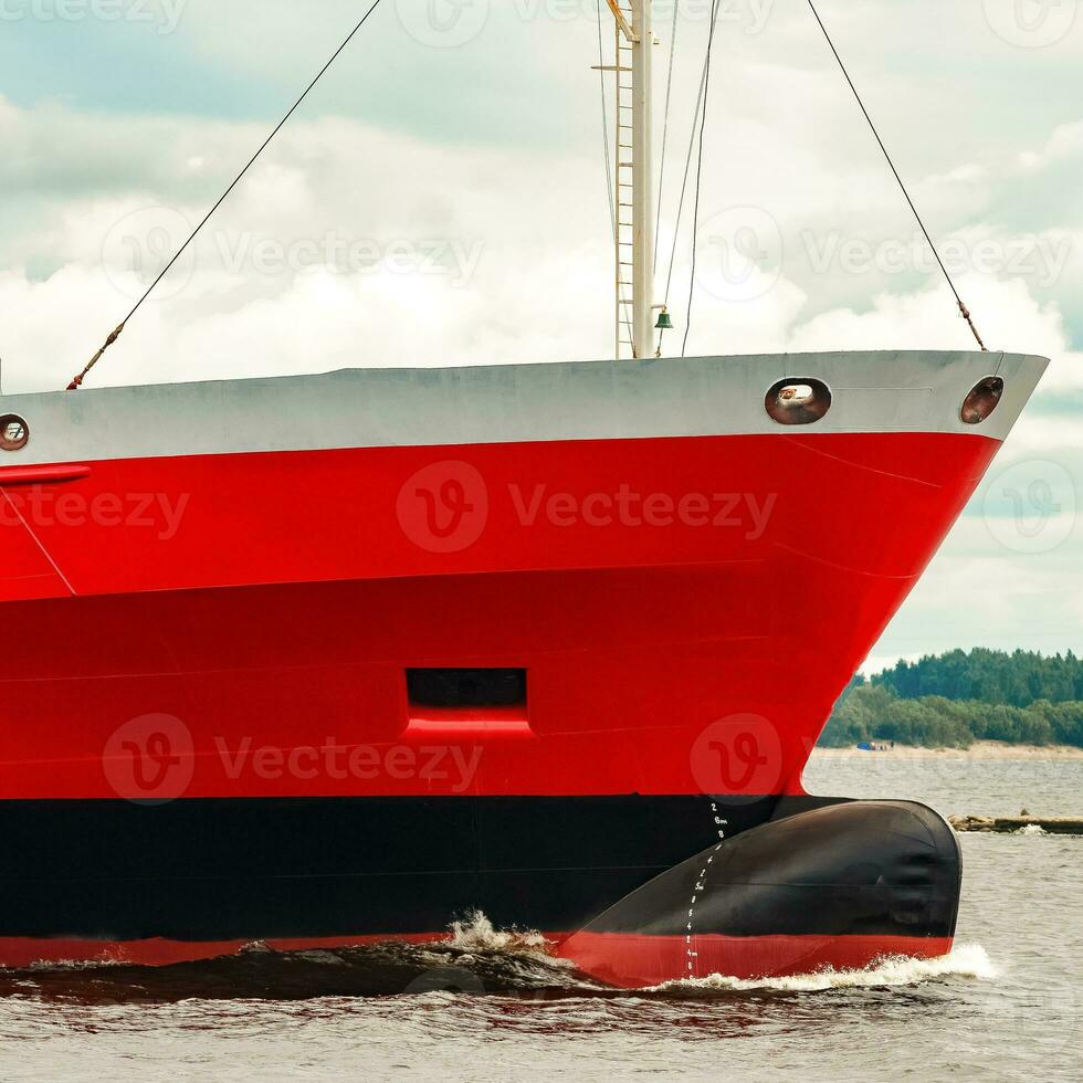 Red new cargo ship moving abroad. Product export in Europe photo