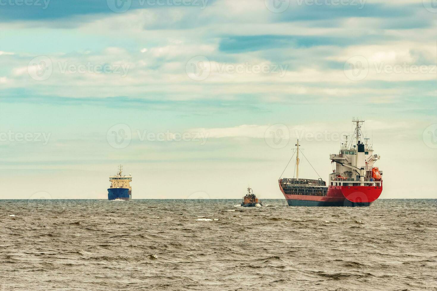 Red new cargo ship moving abroad. Product export in Europe photo