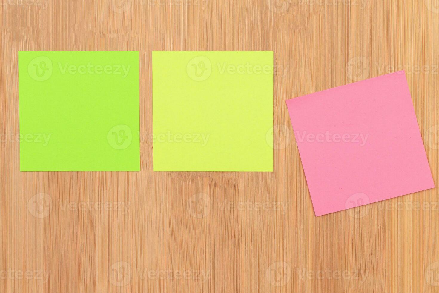 Colored Sticky Notes with Copyspace Pinned to the Wooden Message Board. To Do List Reminder in Office. Blank Memo Sticker at Work Template. Empty Checklist Mockup photo