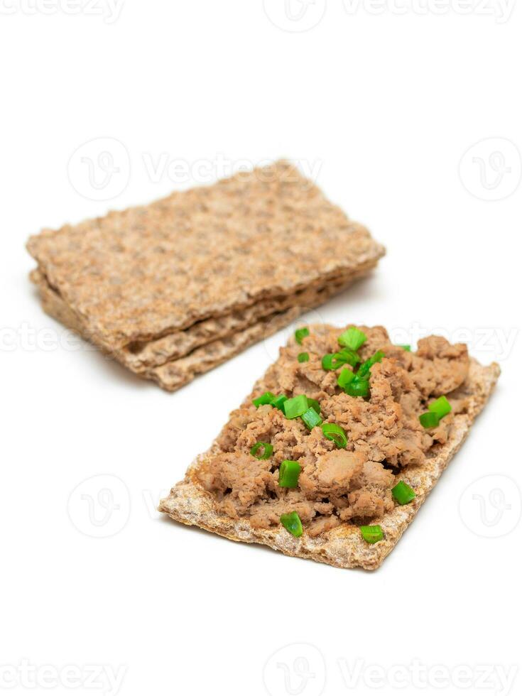 Crispy Sandwich with Chicken Pate and Green Onions Isolated on White Background Top View. Whole Grain Bread with Liver Pate. Diet Breakfast and Healthy Food photo