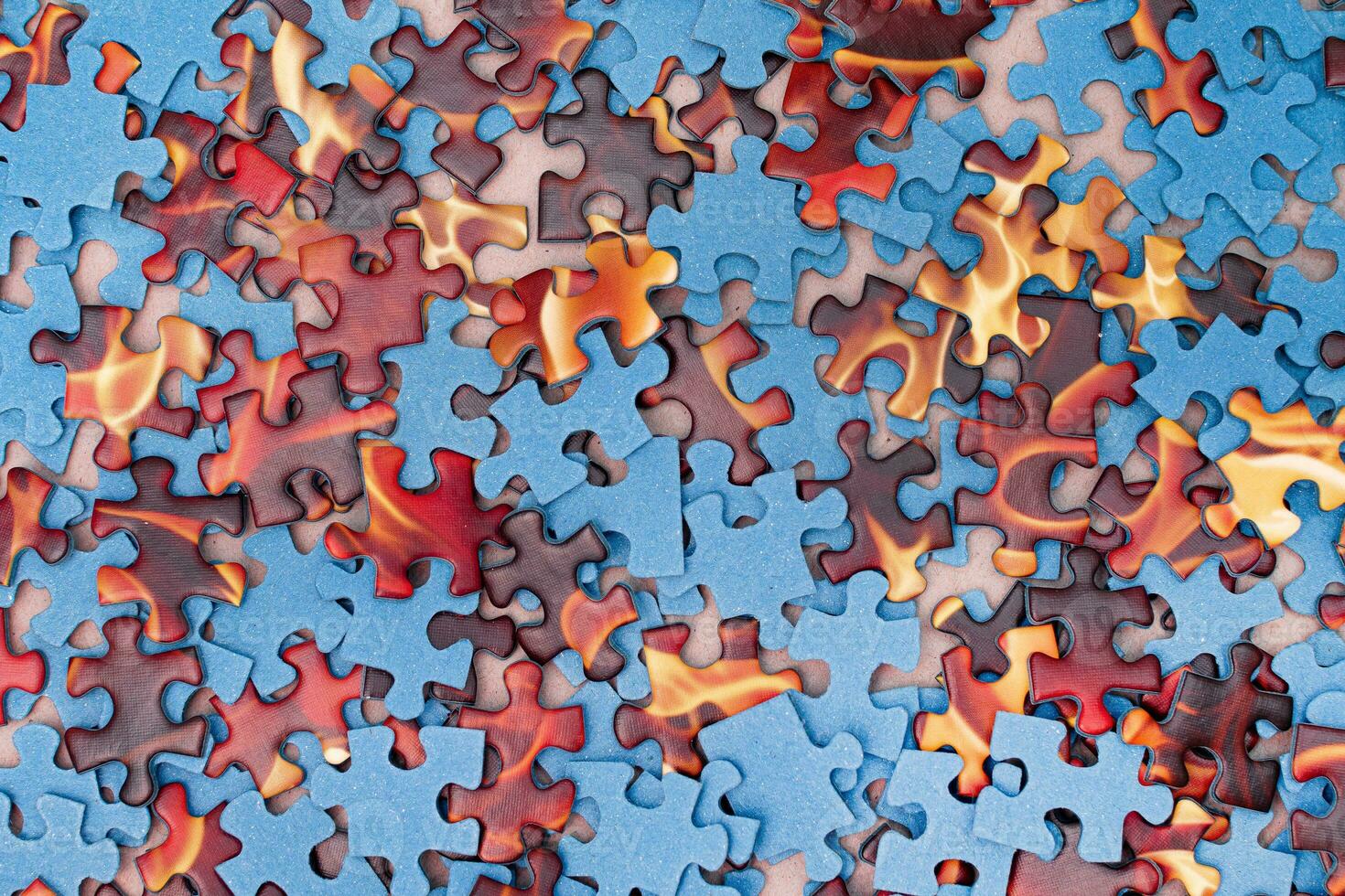 Top View of Mixed Peaces of a Jigsaw Puzzle Texture Background photo