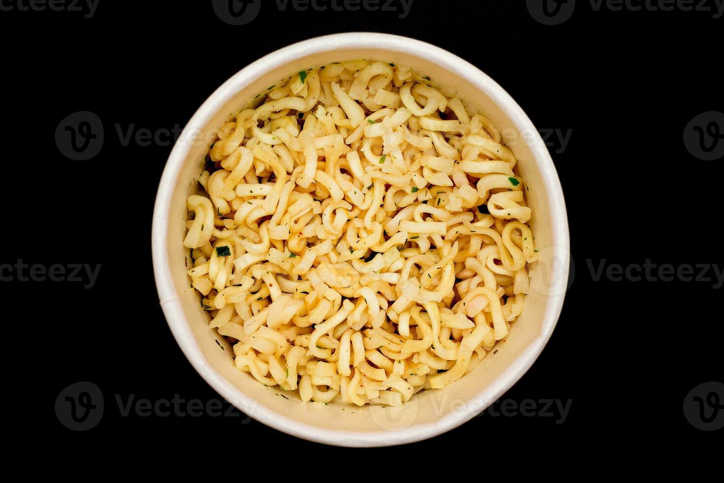 Instant Noodles in Disposable Cup on Black Background Top View. Asian Fast Food. Quick Lunch photo