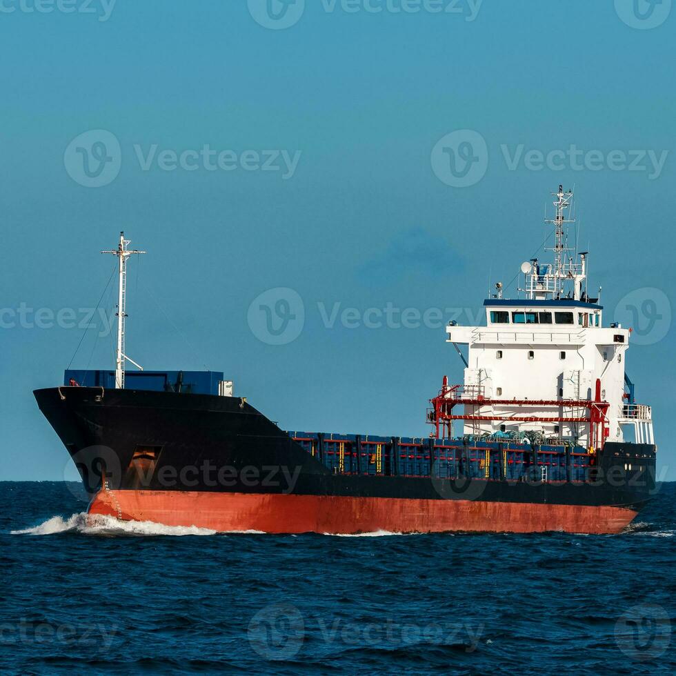 Black bulker ship. Logistics and merchandise transportations photo