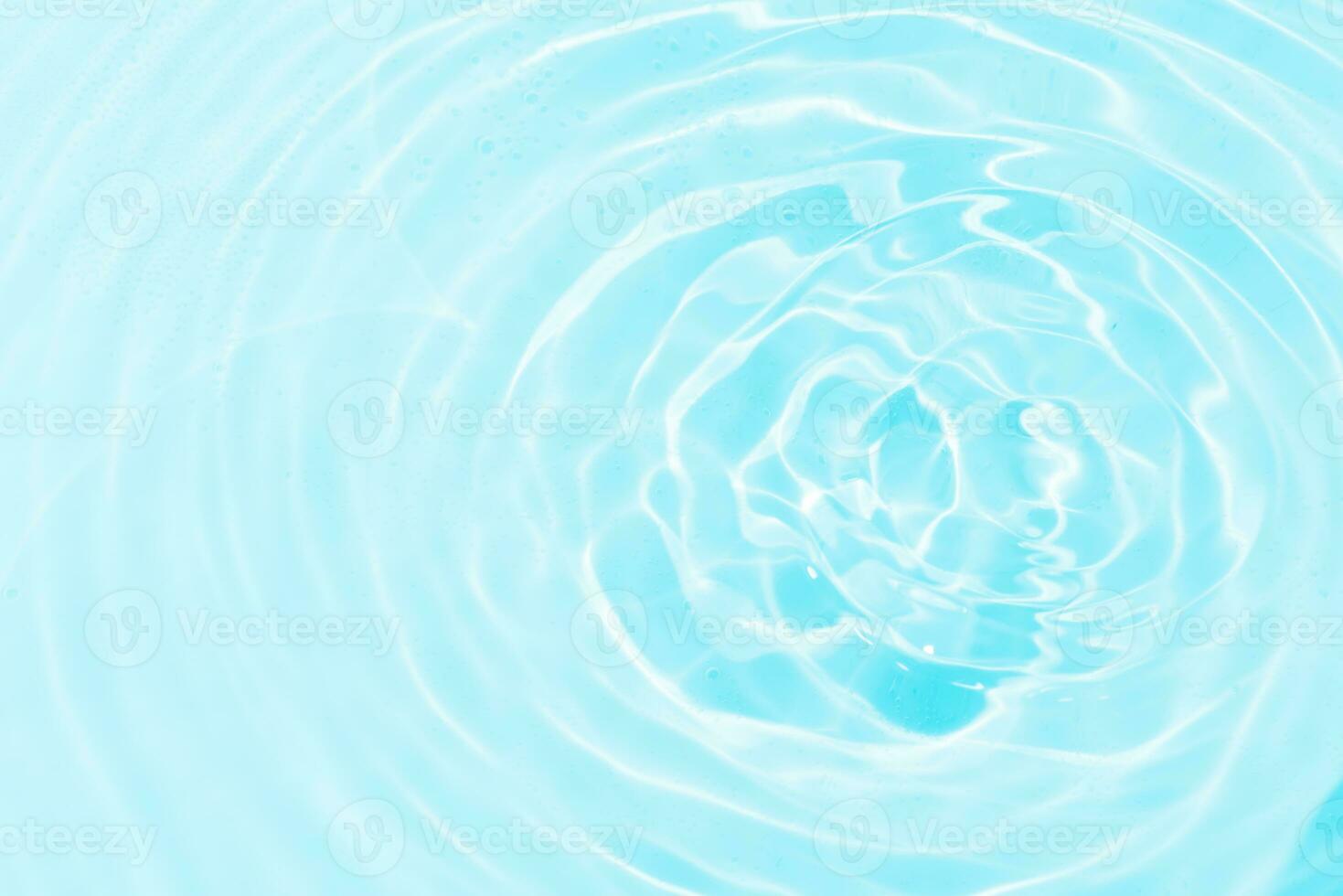 Bluewater bubbles on the surface ripples. Defocus blurred transparent white-black colored clear calm water surface texture with splash and bubbles. Water waves with shining pattern texture background. photo