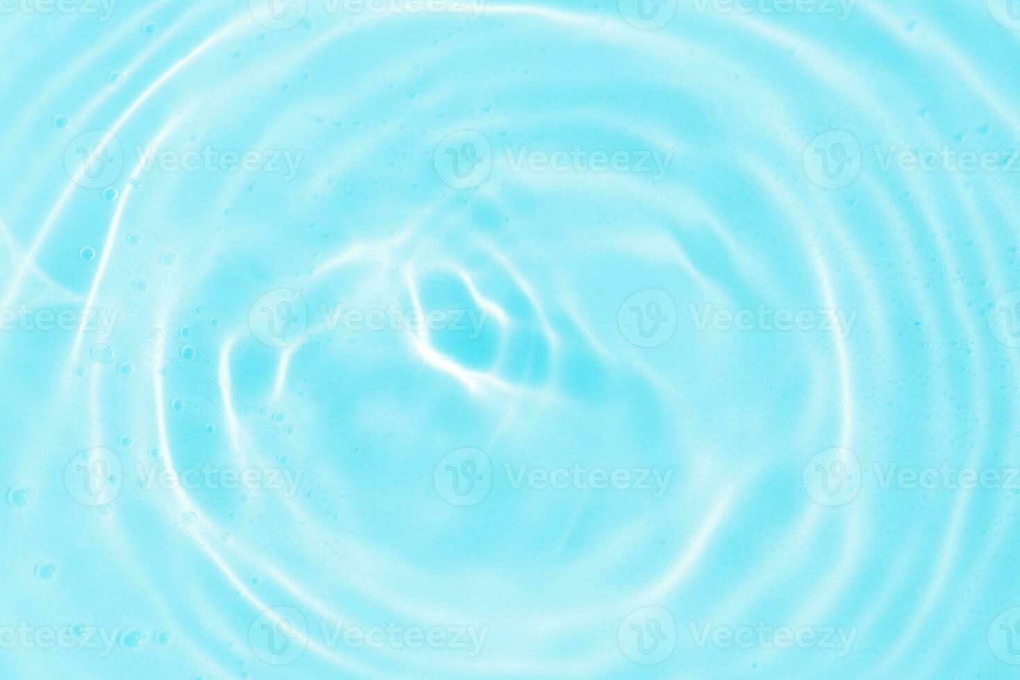 Bluewater bubbles on the surface ripples. Defocus blurred transparent white-black colored clear calm water surface texture with splash and bubbles. Water waves with shining pattern texture background. photo