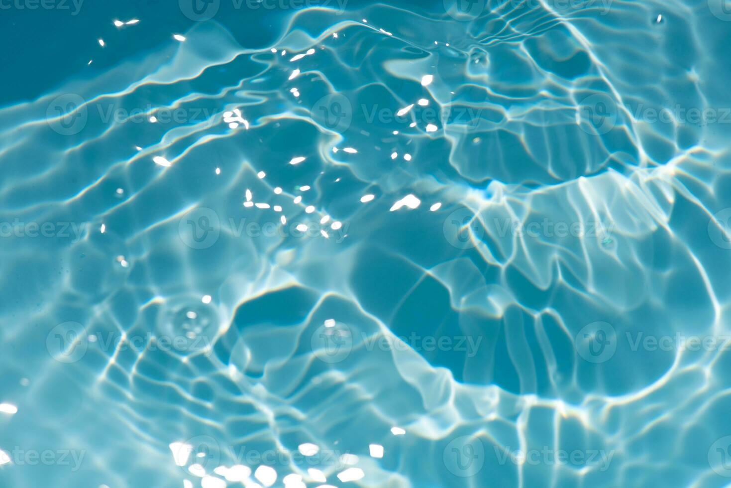Bluewater bubbles on the surface ripples. Defocus blurred transparent white-black colored clear calm water surface texture with splash and bubbles. Water waves with shining pattern texture background. photo