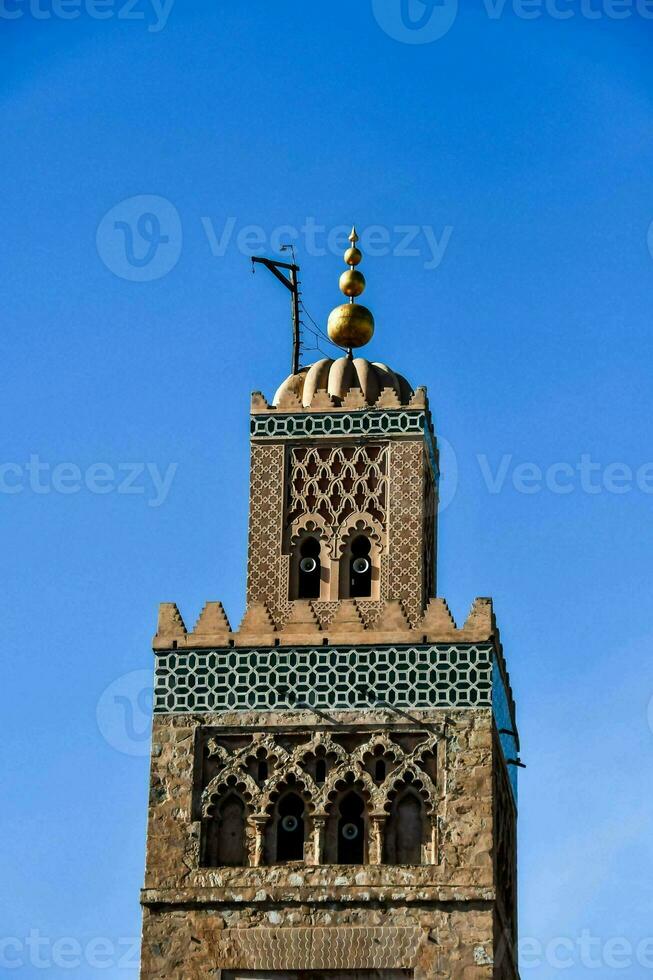 the clock tower of the mosque in marrakech photo