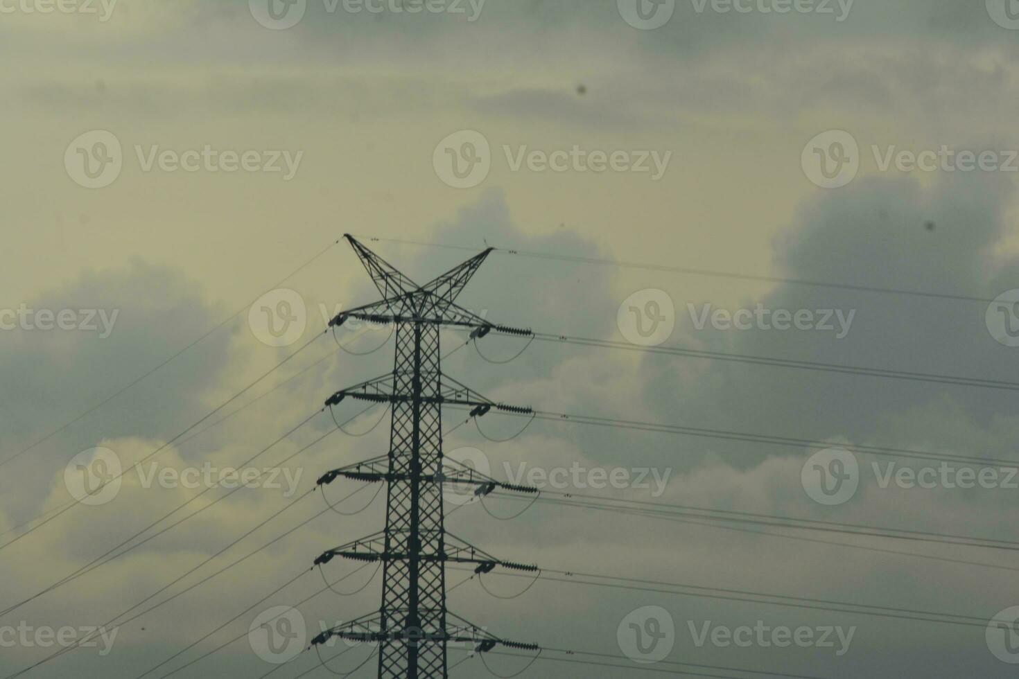 background photo of a cloudy sky with an electricity tower
