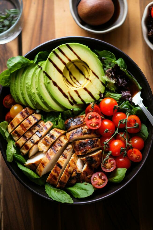 ai generado un ensalada cuenco lleno con un mezcla de verduras, rebanado aguacate foto