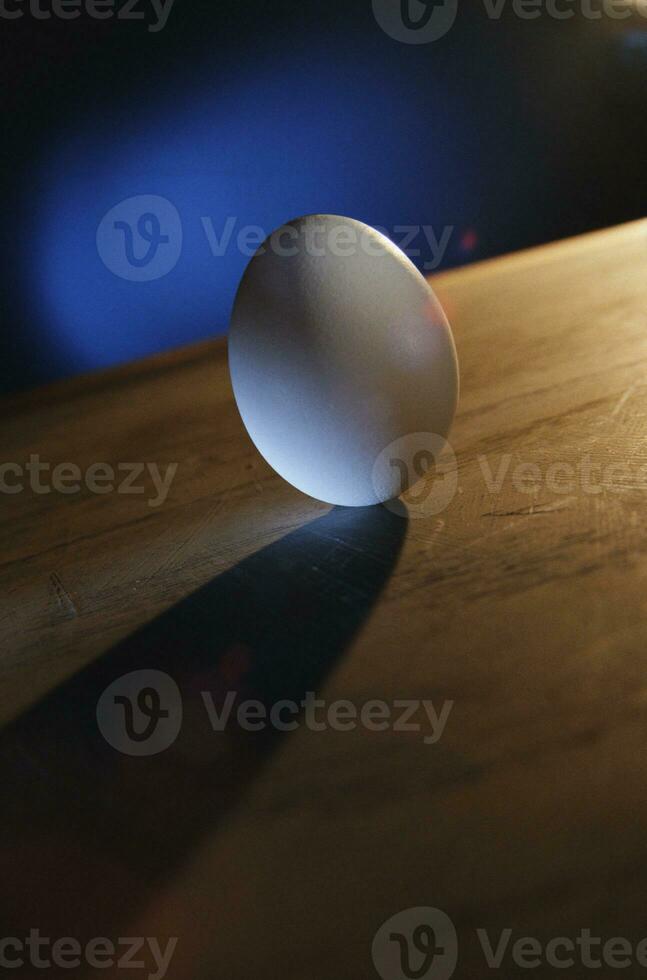 white egg with shadow macro photo