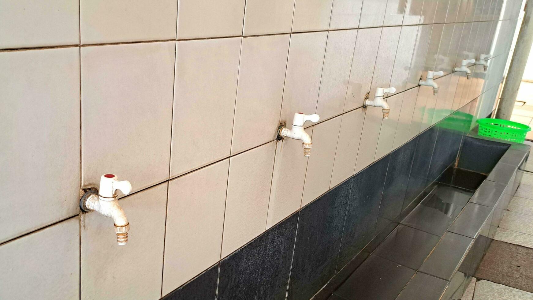 row of water faucets photo